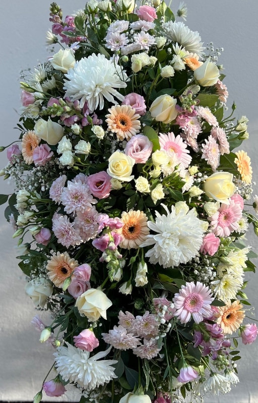 Soft pastels casket spray