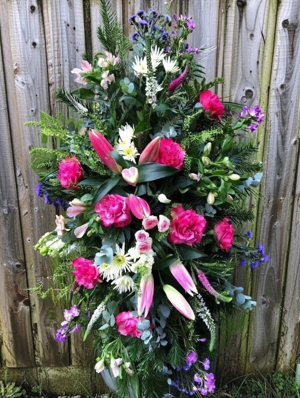 Cerise Pink, Purples and Creams casket spray