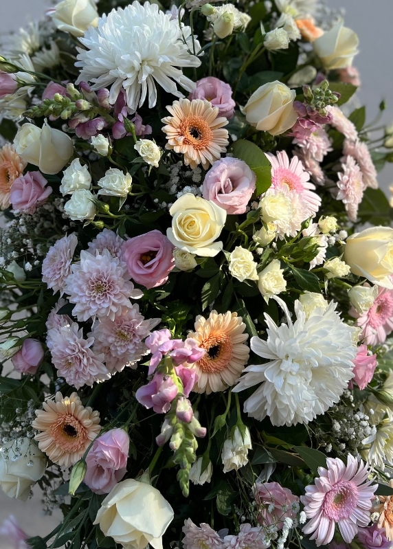 Soft pastels casket spray